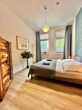 Erholsame City-Erdgeschosswohnung mit Veranda, Grill und Parkplatz D46EG